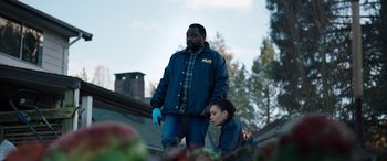 Movie still from “Child's Play” (2019), directed by Lars Klevberg – A man and a woman standing next to each other; Medium shot, Low angle