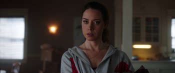 Movie still from “Child's Play” (2019), directed by Lars Klevberg – A woman in a gray and red jacket looking at the camera; Close Up shot, Over the shoulder angle