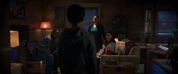 Movie still from “Child's Play” (2019), directed by Lars Klevberg – A group of people in a living room; Wide shot, Over the shoulder angle