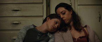 Movie still from “Child's Play” (2019), directed by Lars Klevberg – A woman and a young boy sleeping next to each other; Close Up shot, Over the shoulder angle