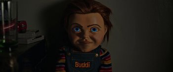 Movie still from “Child's Play” (2019), directed by Lars Klevberg – The head of a chucky doll with blue eyes; Close Up shot, High angle