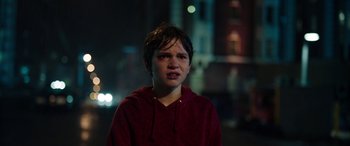 Movie still from “Child's Play” (2019), directed by Lars Klevberg – A young boy in a red shirt is looking at the camera; Close Up shot, High angle