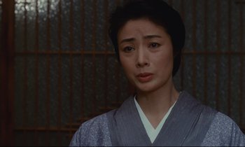 Movie still from “Chizuko's Younger Sister” (1991), directed by Nobuhiko Ôbayashi – A woman in a kimono looking at the camera; Close Up shot, Low angle