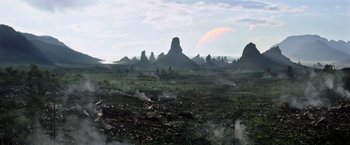 Movie still from “The Dark Tower” (2017), directed by Nikolaj Arcel – An image of an alien landscape with mountains in the background; Extreme Wide shot, High angle