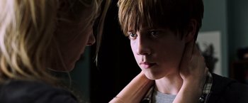 Movie still from “The Dark Tower” (2017), directed by Nikolaj Arcel – A young boy is looking at a woman; Close Up shot, Over the shoulder angle