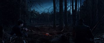 Movie still from “The Dark Tower” (2017), directed by Nikolaj Arcel – A fire in the middle of a forest at night; Extreme Wide shot, High angle