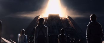Movie still from “The Dark Tower” (2017), directed by Nikolaj Arcel – Two people standing in front of an illuminated structure; Extreme Wide shot, Low angle