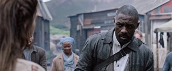 Movie still from “The Dark Tower” (2017), directed by Nikolaj Arcel – A man and a woman walking down a street; Medium shot, Over the shoulder angle