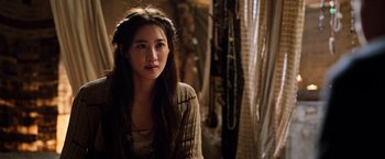 Movie still from “The Dark Tower” (2017), directed by Nikolaj Arcel – A woman with long brown hair wearing a white shirt; Close Up shot, Over the shoulder angle