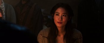 Movie still from “The Dark Tower” (2017), directed by Nikolaj Arcel – A beautiful young woman with long dark brown hair; Close Up shot, Over the shoulder angle