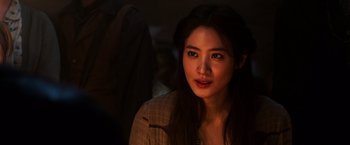 Movie still from “The Dark Tower” (2017), directed by Nikolaj Arcel – A beautiful young woman with long dark brown hair; Close Up shot, Over the shoulder angle