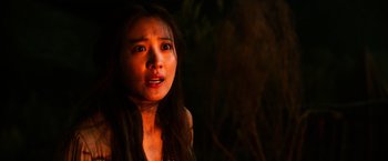 Movie still from “The Dark Tower” (2017), directed by Nikolaj Arcel – A young woman with long dark brown hair and brown eyes; Close Up shot, High angle