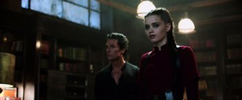 Movie still from “The Dark Tower” (2017), directed by Nikolaj Arcel – A man and a woman standing next to each other in a room; Close Up shot, Low angle