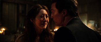 Movie still from “The Dark Tower” (2017), directed by Nikolaj Arcel – A man and a woman are looking at one another; Close Up shot, Over the shoulder angle