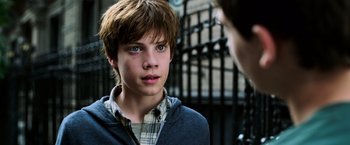 Movie still from “The Dark Tower” (2017), directed by Nikolaj Arcel – A young boy with blue eyes stares at a person; Close Up shot, Over the shoulder angle