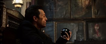 Movie still from “The Dark Tower” (2017), directed by Nikolaj Arcel – A man holding an object in his hands; Close Up shot, Low angle