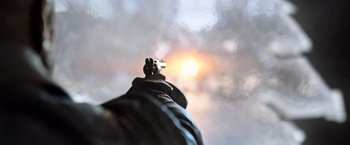 Movie still from “The Dark Tower” (2017), directed by Nikolaj Arcel – The sight of a gun in front of a cloudy sky; Extreme Close Up shot, Low angle
