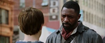 Movie still from “The Dark Tower” (2017), directed by Nikolaj Arcel – A man with a beard is talking to another man; Close Up shot, Over the shoulder angle