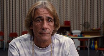 Movie still from “Choke” (2008), directed by Clark Gregg – A person with long blonde hair; Close Up shot, Over the shoulder angle