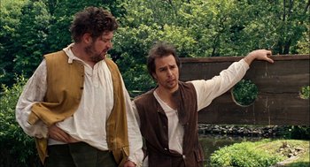 Movie still from “Choke” (2008), directed by Clark Gregg – Two men in medieval garb standing next to each other; Medium shot, Over the shoulder angle