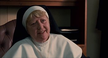 Movie still from “Choke” (2008), directed by Clark Gregg – An older woman wearing a nun's outfit; Close Up shot, High angle