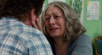 Movie still from “Choke” (2008), directed by Clark Gregg – An older woman crying next to a younger man; Close Up shot, Over the shoulder angle