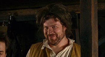 Movie still from “Choke” (2008), directed by Clark Gregg – A person wearing a wig; Close Up shot, Over the shoulder angle