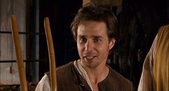 Movie still from “Choke” (2008), directed by Clark Gregg – A person holding a wooden stick; Close Up shot, Over the shoulder angle