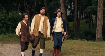 Movie still from “Choke” (2008), directed by Clark Gregg – A group of people walking in a forest; Medium shot, Over the shoulder angle