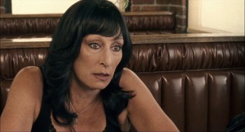 Movie still from “Choke” (2008), directed by Clark Gregg – A person sitting in a chair; Close Up shot, High angle