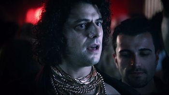 Movie still from “Chopper” (2000), directed by Andrew Dominik – A person wearing chains; Close Up shot, Low angle