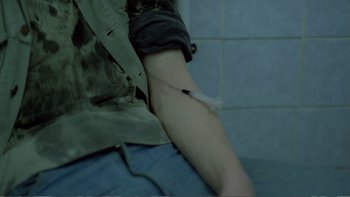 Movie still from “Christiane F.” (1981), directed by Uli Edel – A person with a blood bag on their arm; Extreme Close Up shot, High angle