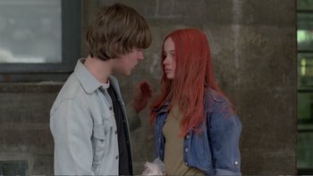 Movie still from “Christiane F.” (1981), directed by Uli Edel – A man and a woman standing next to each other; Medium shot, Over the shoulder angle