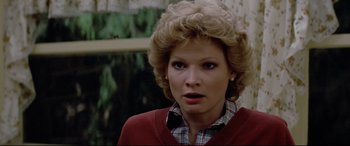 Movie still from “Christine” (1983), directed by John Carpenter – A person wearing a plaid shirt; Close Up shot, Over the shoulder angle