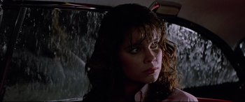 Movie still from “Christine” (1983), directed by John Carpenter – A person in a car; Close Up shot, Low angle