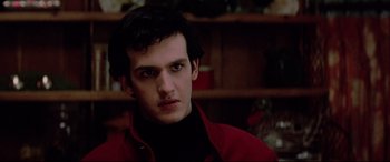 Movie still from “Christine” (1983), directed by John Carpenter – A man in a red jacket is looking at the camera; Close Up shot, Low angle