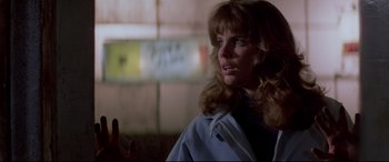 Movie still from “Christine” (1983), directed by John Carpenter – A person wearing a blue shirt; Close Up shot, Over the shoulder angle