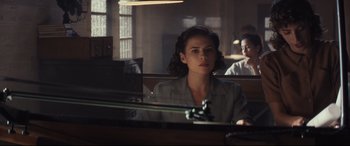 Movie still from “Christopher Robin” (2018), directed by Marc Forster – A woman sitting in front of a mirror in a room; Medium shot, Over the shoulder angle