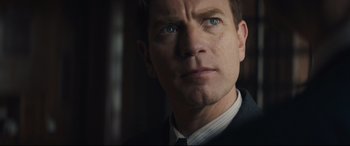 Movie still from “Christopher Robin” (2018), directed by Marc Forster – A person wearing a suit and tie; Close Up shot, Low angle