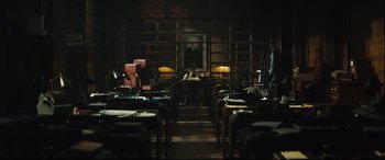 Movie still from “Christopher Robin” (2018), directed by Marc Forster – A room filled with lots of tables and chairs; Extreme Wide shot, High angle