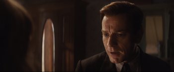 Movie still from “Christopher Robin” (2018), directed by Marc Forster – A person wearing a suit and tie; Close Up shot, Over the shoulder angle