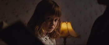 Movie still from “Christopher Robin” (2018), directed by Marc Forster – A little girl is looking at the camera; Close Up shot, Over the shoulder angle