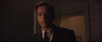Movie still from “Christopher Robin” (2018), directed by Marc Forster – A person wearing a suit and tie; Close Up shot, Low angle