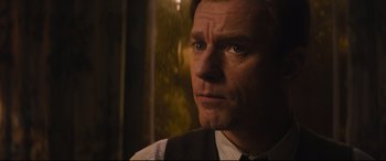 Movie still from “Christopher Robin” (2018), directed by Marc Forster – A person wearing a suit and tie; Close Up shot, Low angle