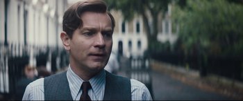 Movie still from “Christopher Robin” (2018), directed by Marc Forster – A person wearing a suit and tie; Close Up shot, Over the shoulder angle