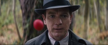 Movie still from “Christopher Robin” (2018), directed by Marc Forster – A person wearing a hat and a tie; Close Up shot, Low angle