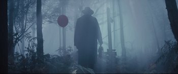Movie still from “Christopher Robin” (2018), directed by Marc Forster – A man in a long black coat and a hat in the fog; Wide shot, Low angle
