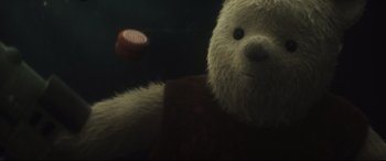 Movie still from “Christopher Robin” (2018), directed by Marc Forster – A white teddy bear is in a dark room; Extreme Close Up shot, Overhead angle