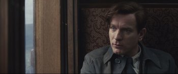 Movie still from “Christopher Robin” (2018), directed by Marc Forster – A man sitting in front of a wooden wall; Close Up shot, Over the shoulder angle