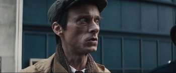 Movie still from “Christopher Robin” (2018), directed by Marc Forster – A person wearing a hat and a coat; Close Up shot, Low angle